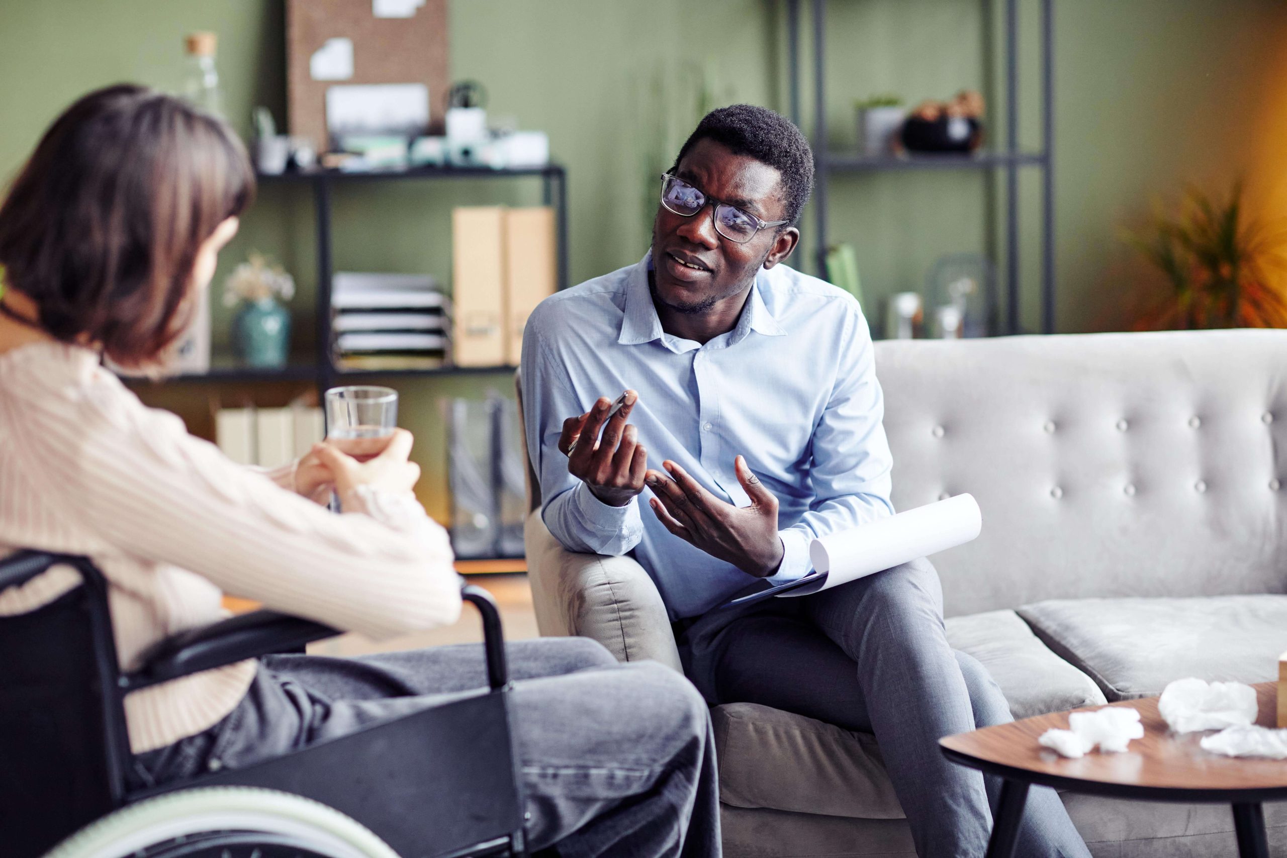 psychologist-talking-to-woman-with-disability-2023-11-27-04-54-05-utc