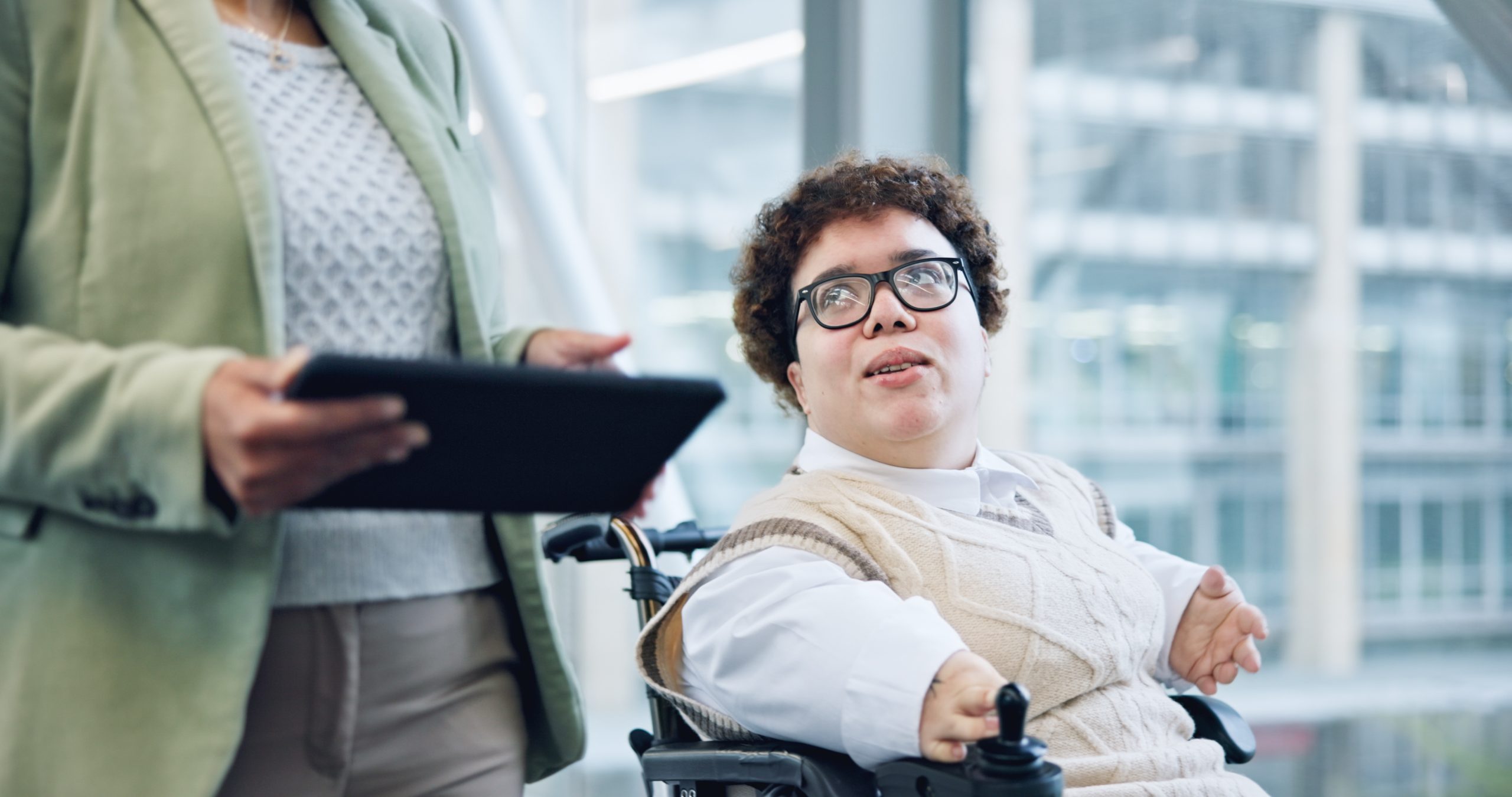 tablet-discussion-and-business-woman-in-wheelchai-2023-12-01-06-16-10-utc